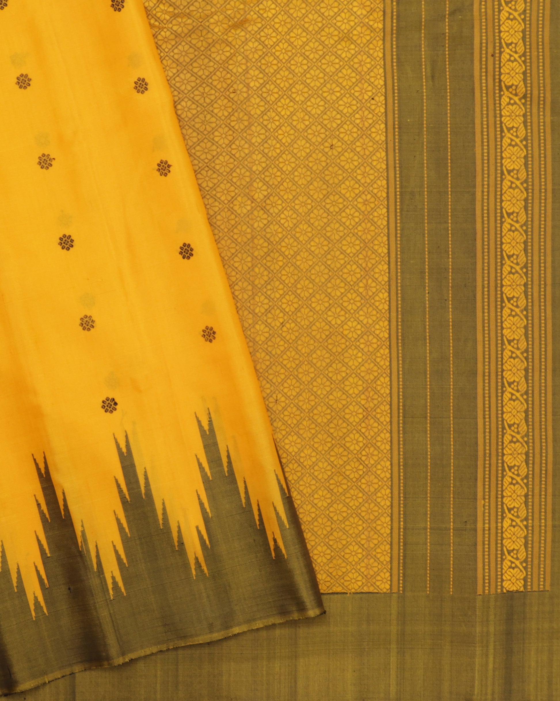 Mustard yellow Gadwal silk saree with olive green temple border and zari butas