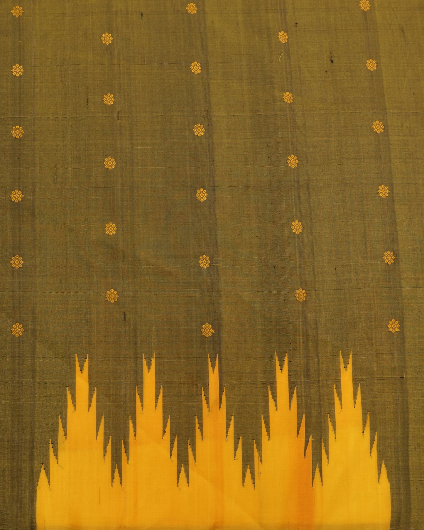 Olive green blouse with zari border paired with mustard yellow Gadwal silk saree