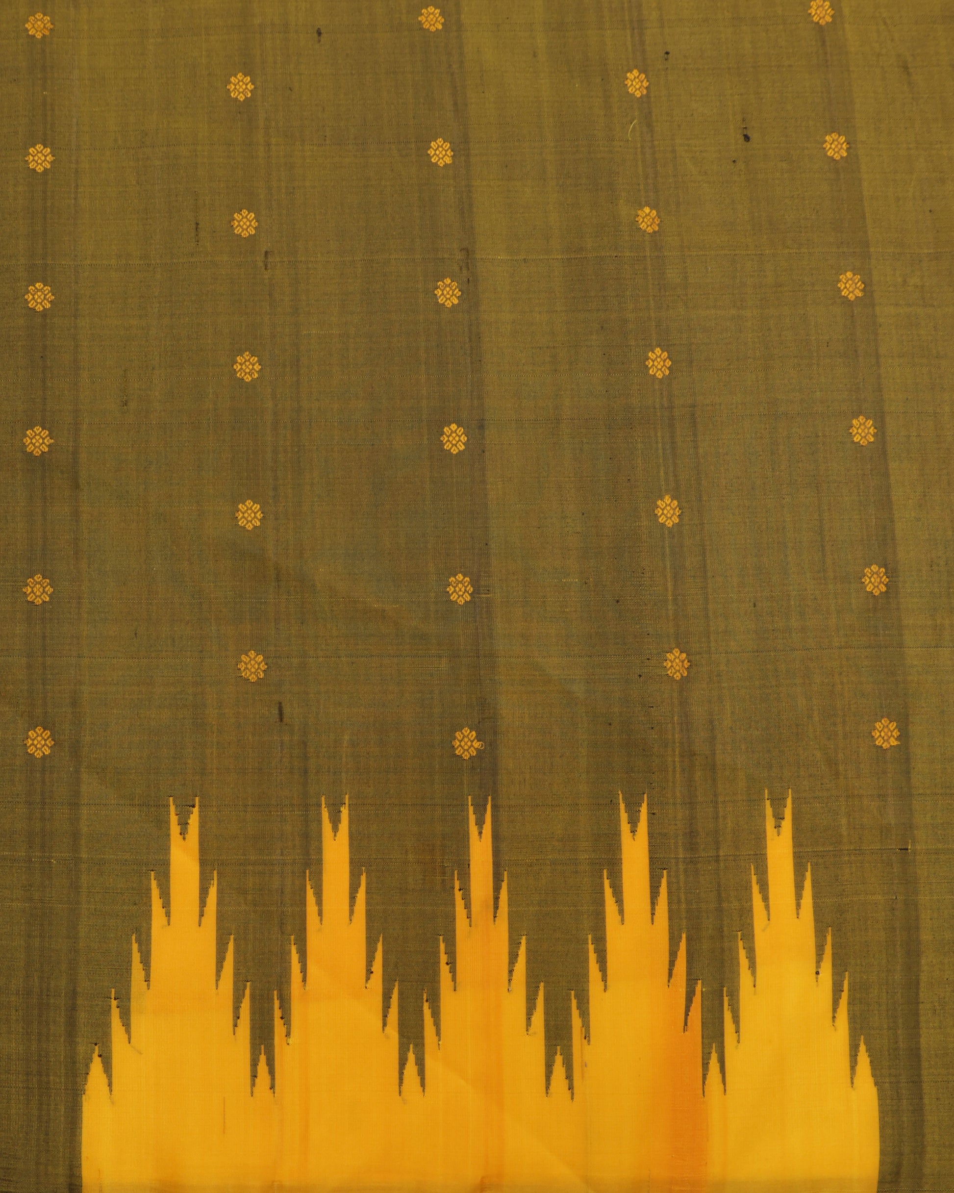 Olive green blouse with zari border paired with mustard yellow Gadwal silk saree