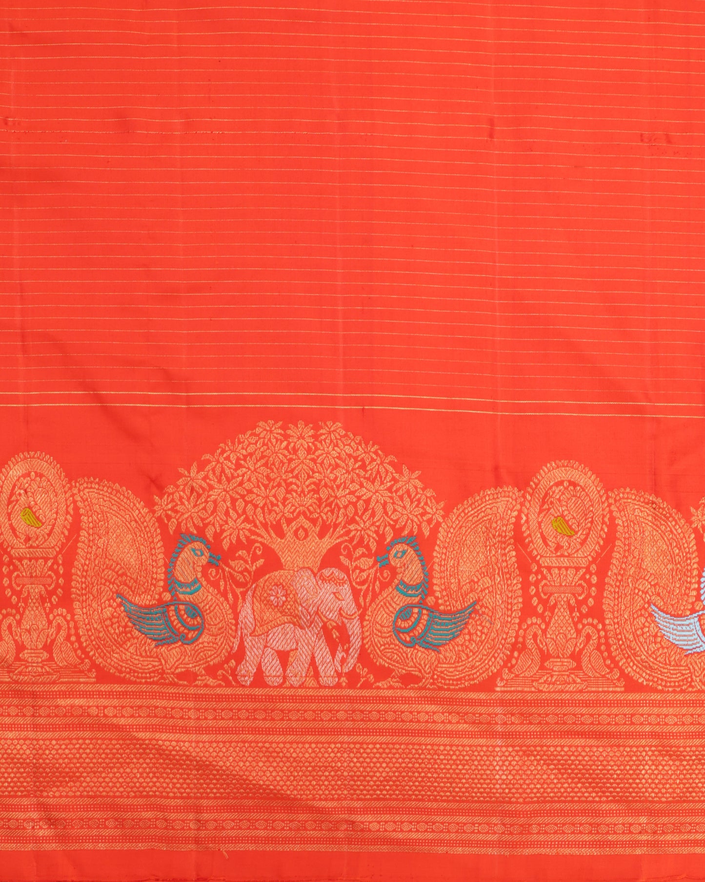 Orange blouse with zari border, included with red Gadwal silk saree