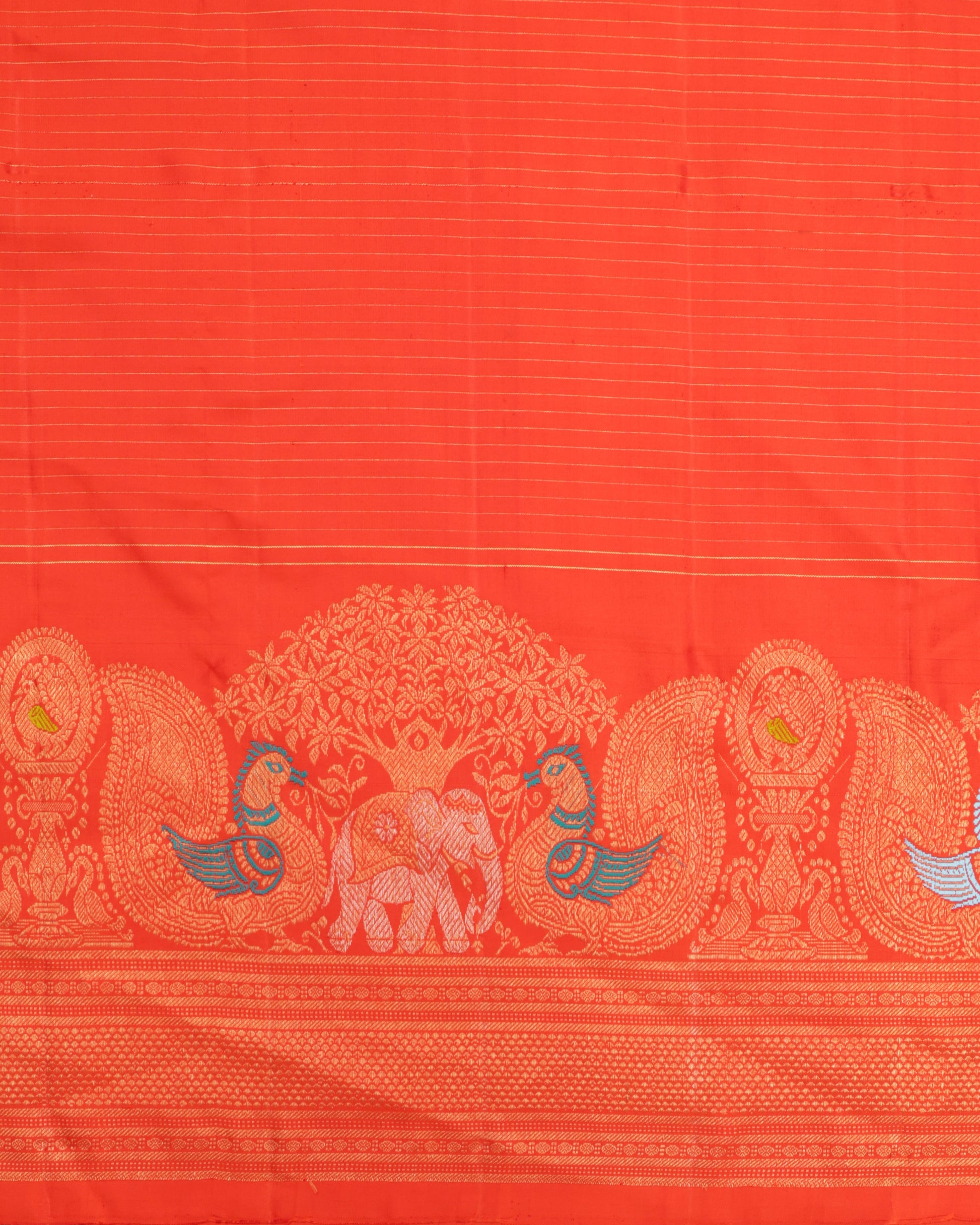 Orange blouse with zari border, included with red Gadwal silk saree