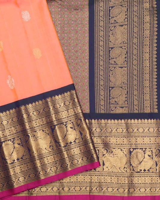 Coral Gadwal silk saree with navy blue zari border and pink selvedge