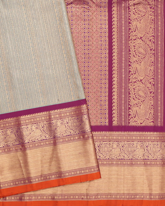 Light aqua blue Gadwal silk saree with purple border and orange selvedge