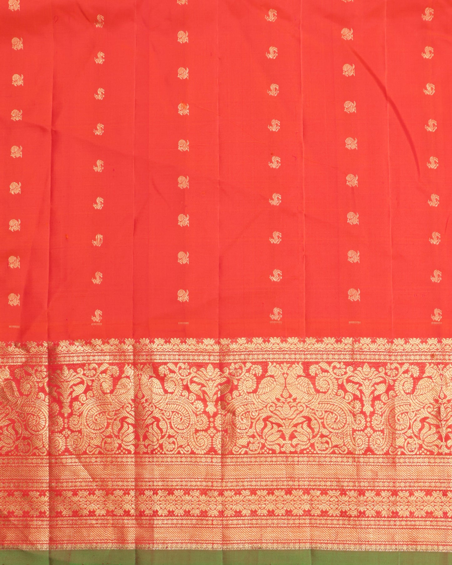 Gadwal silk saree in brown with intricate zari weaving and orange pallu