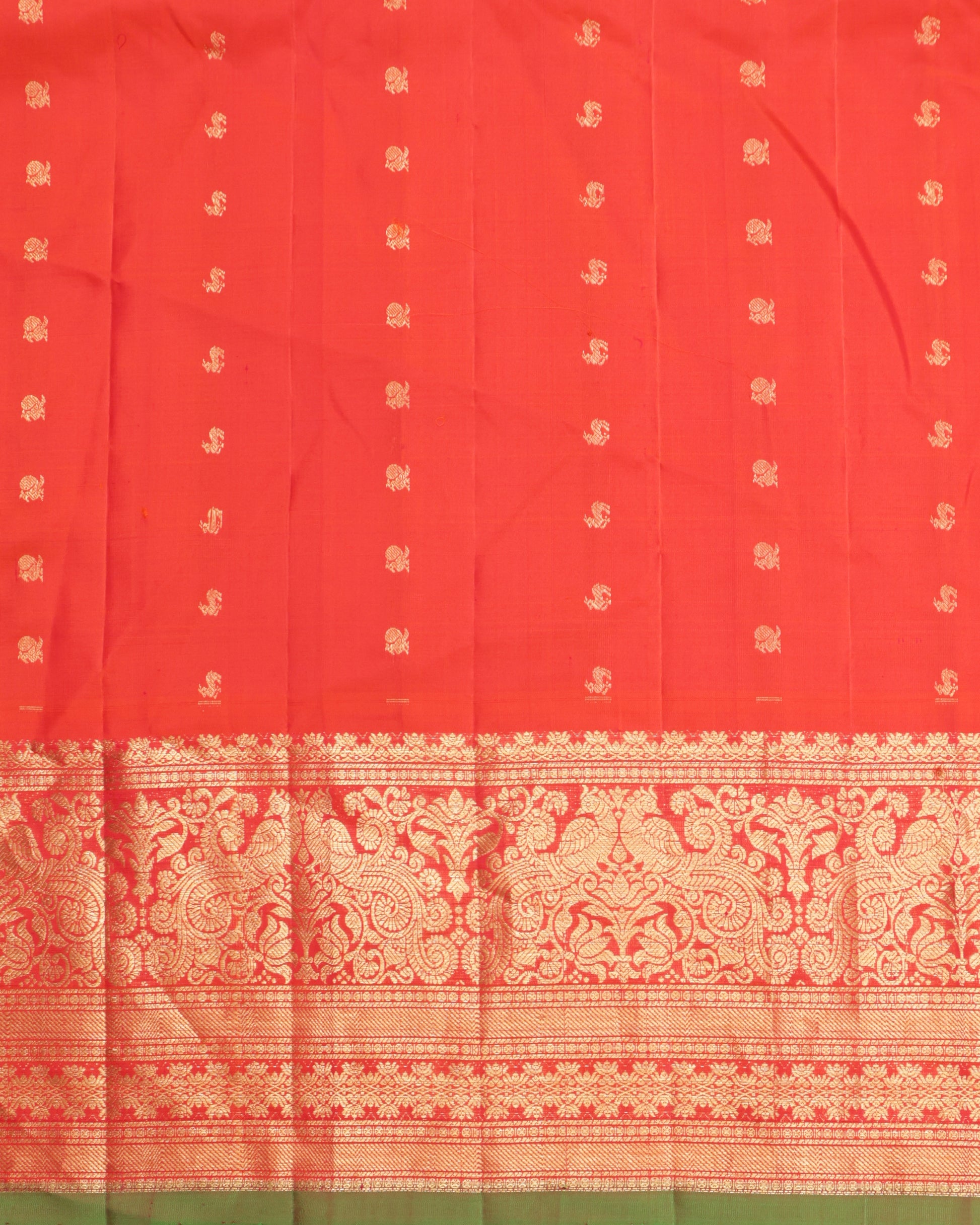 Gadwal silk saree in brown with intricate zari weaving and orange pallu