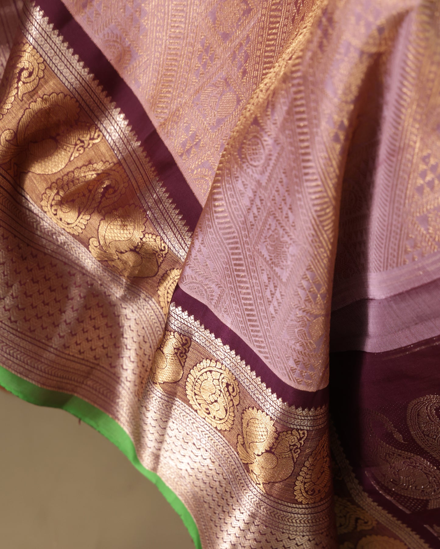 Elegant peach brocade Gadwal saree featuring zari motifs