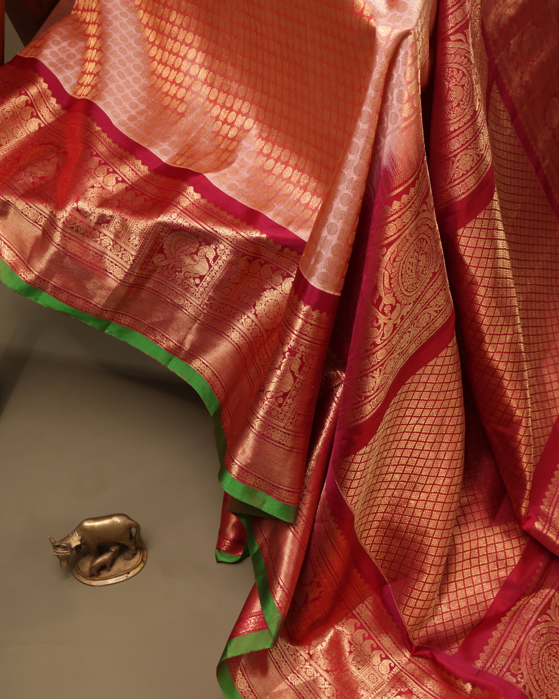 Peach Gadwal saree with contrast vermilion border in zari weave and green edge