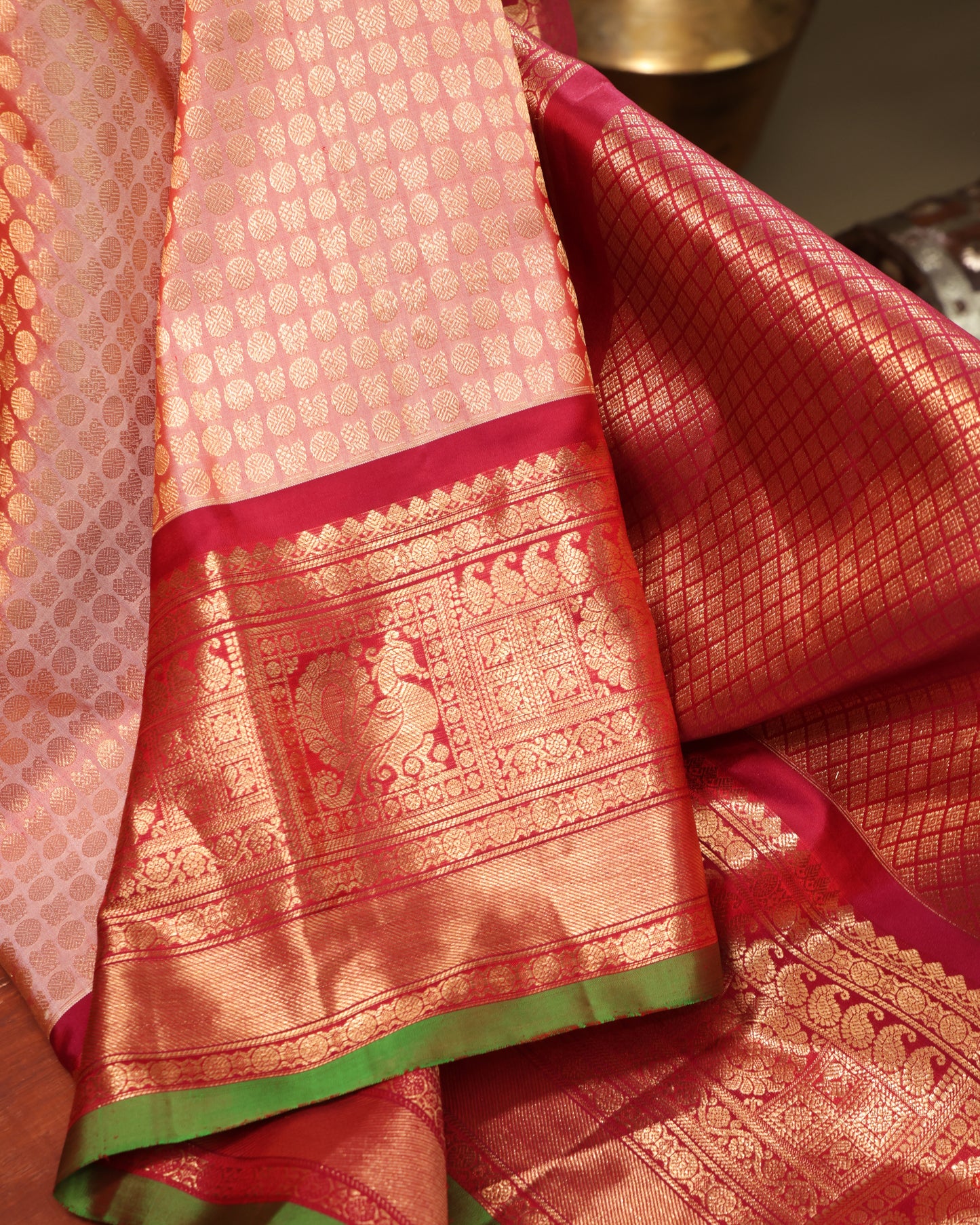 Vermilion blouse with gold zari motifs and matching border, included with Gadwal silk saree