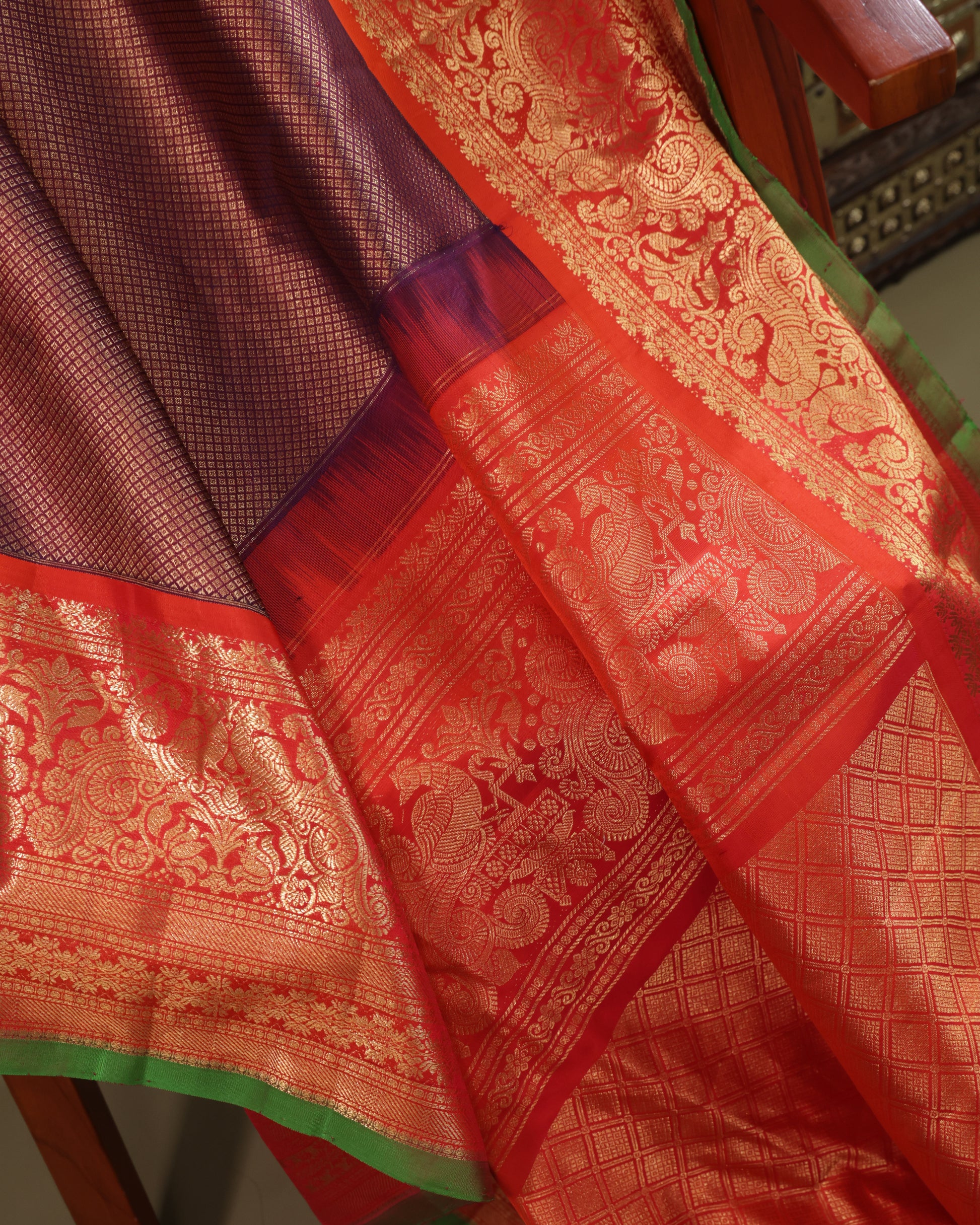 Orange blouse with gold zari motifs and matching border, included with Gadwal silk saree