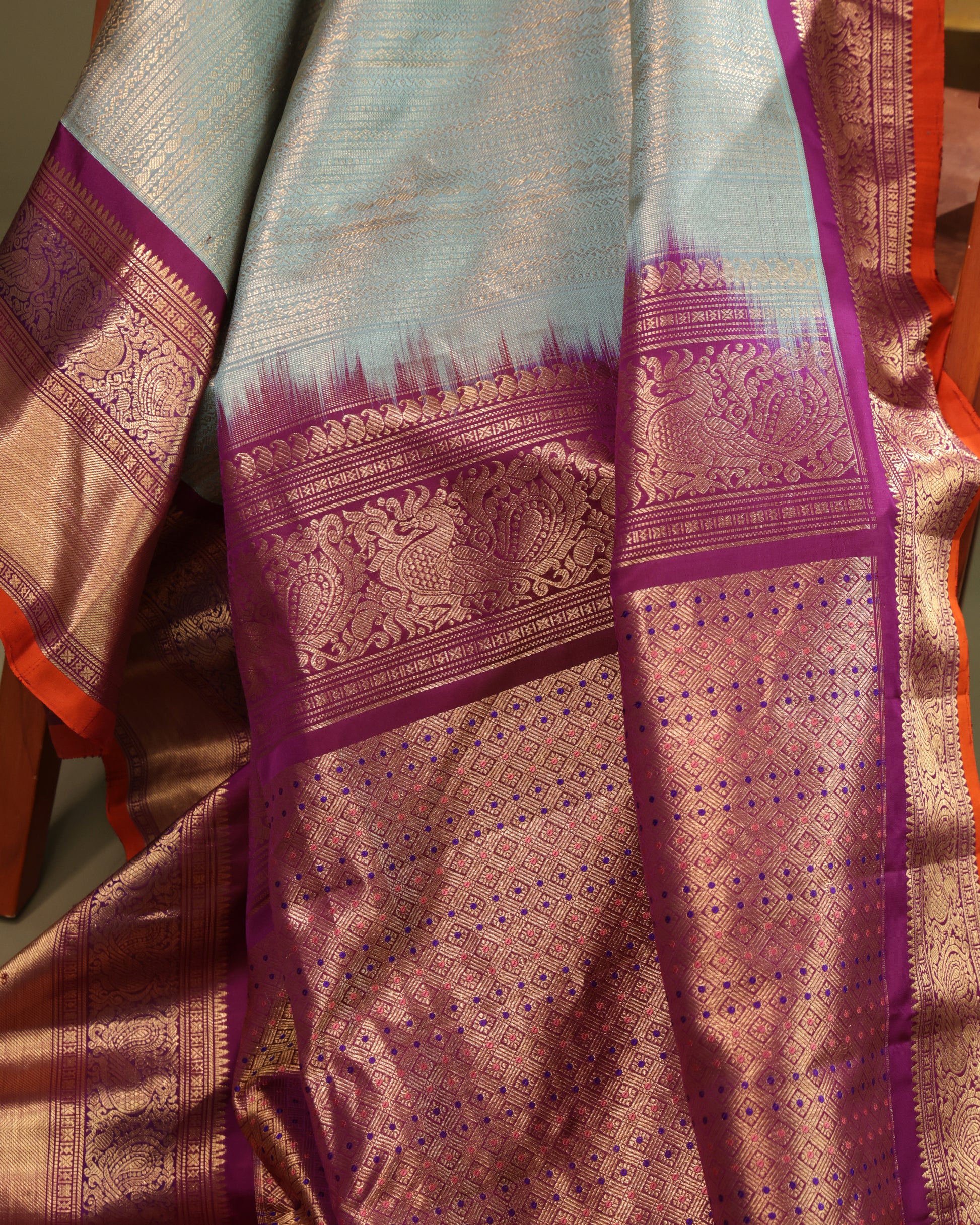 Festive aqua blue Gadwal silk saree with purple and orange contrast