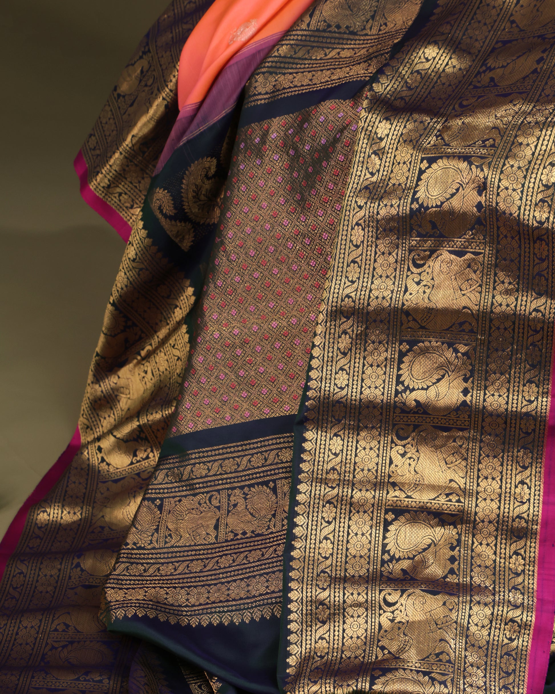 Traditional Gadwal silk saree with peacock motifs on navy border