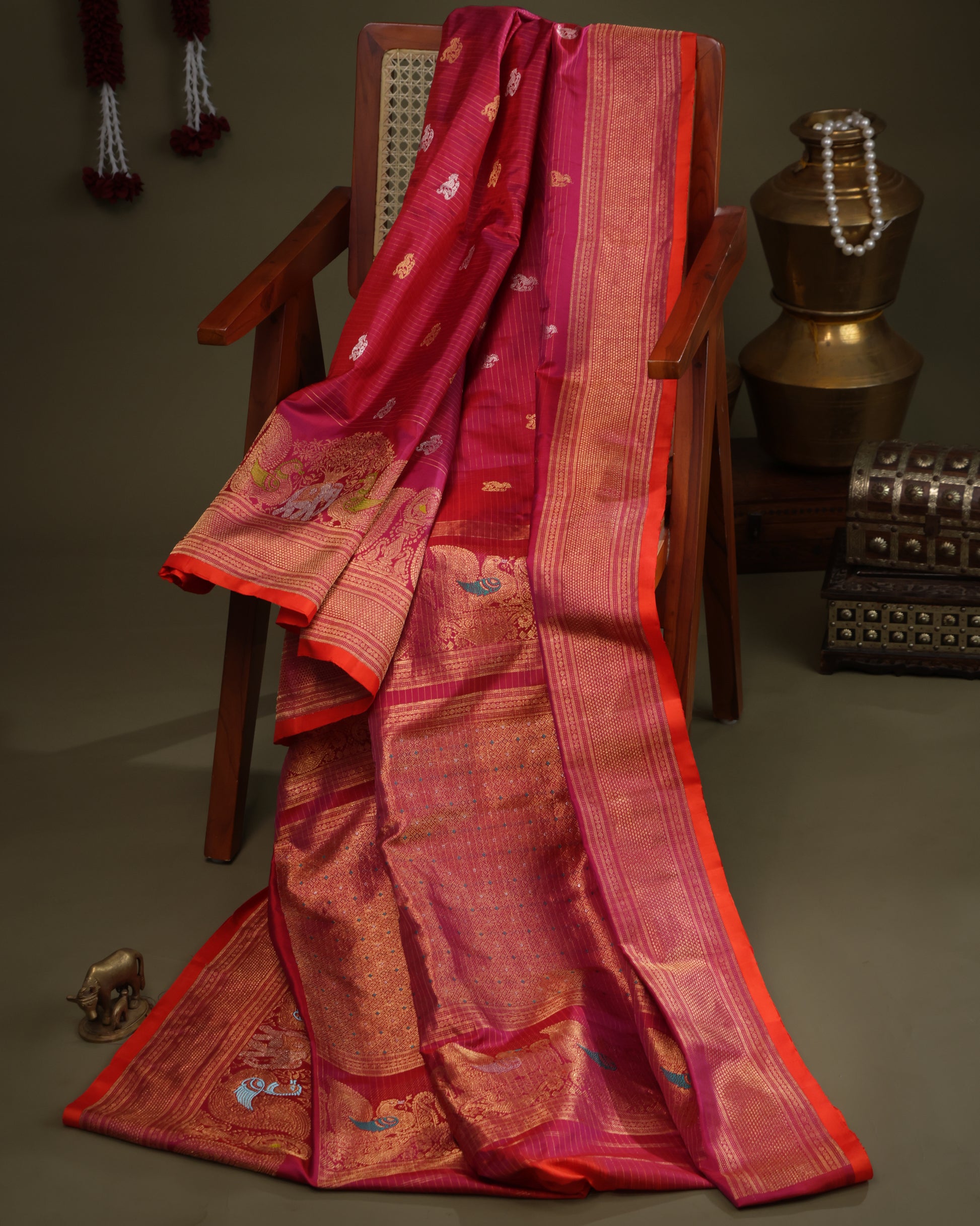 Gadwal silk saree in red with rich zari weaving and orange contrast blouse