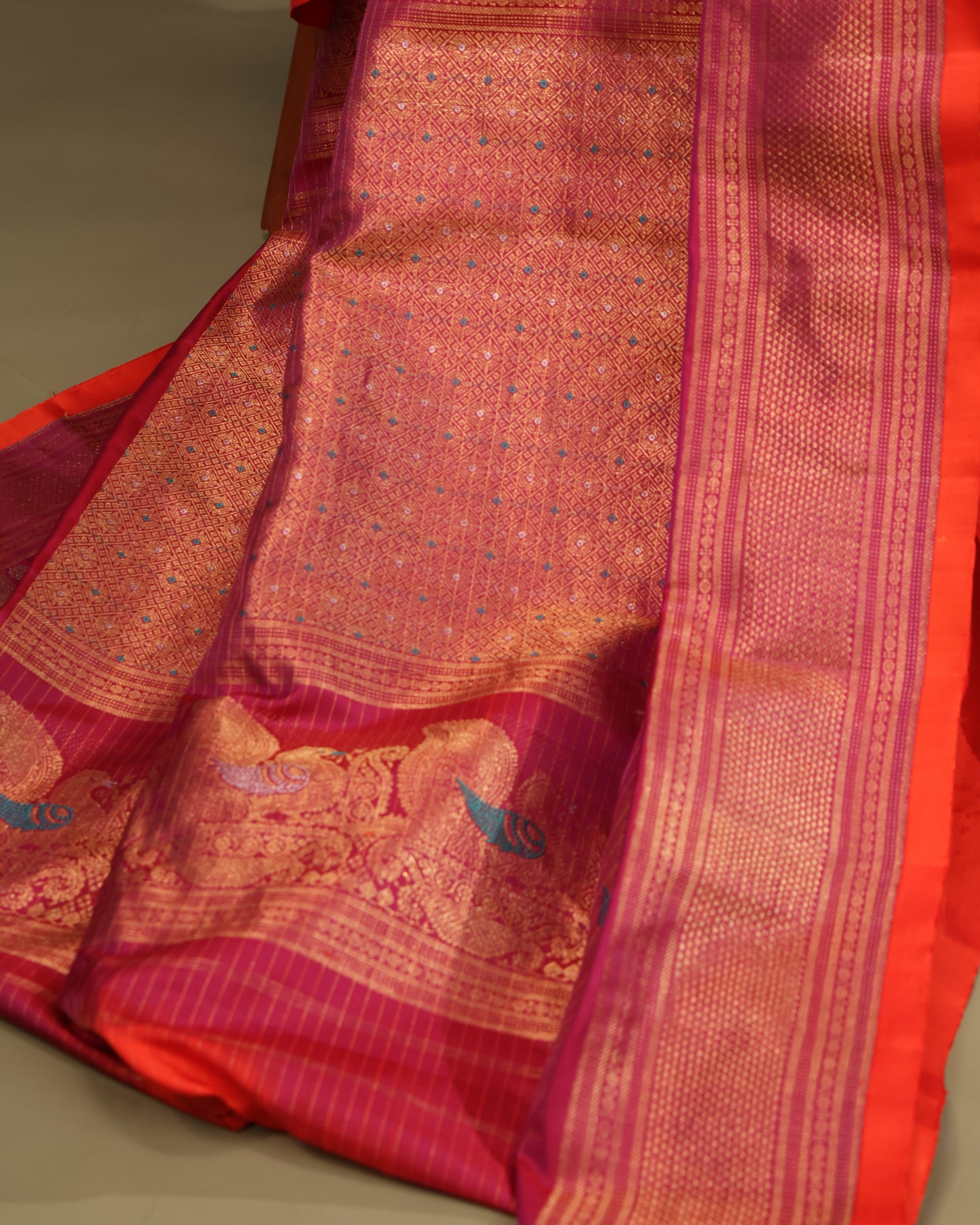 Red Gadwal silk saree with elephant motifs and peacock designs in zari