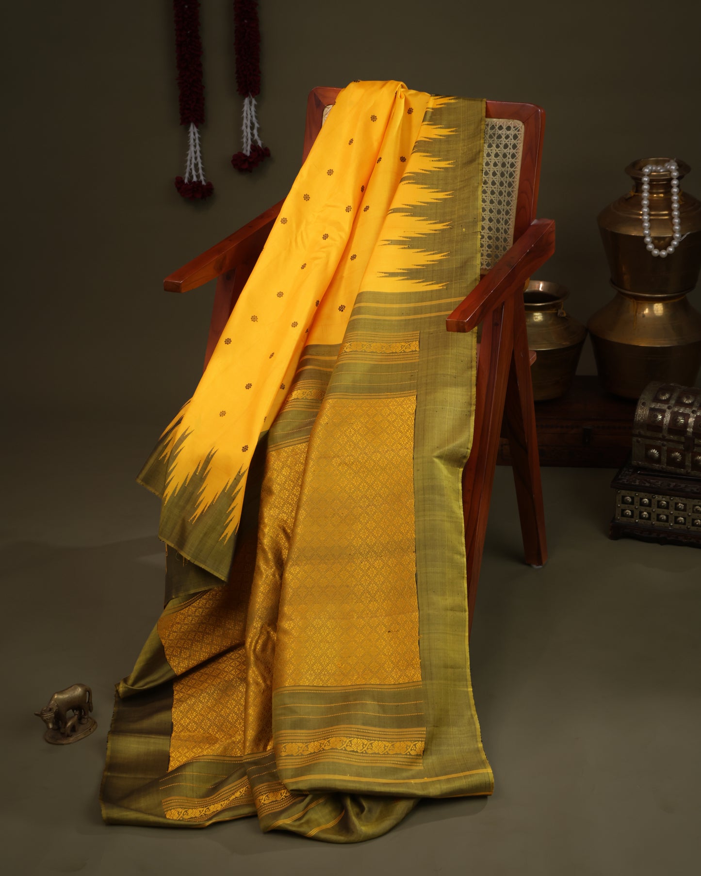 Zari buta motifs on mustard yellow Gadwal silk saree