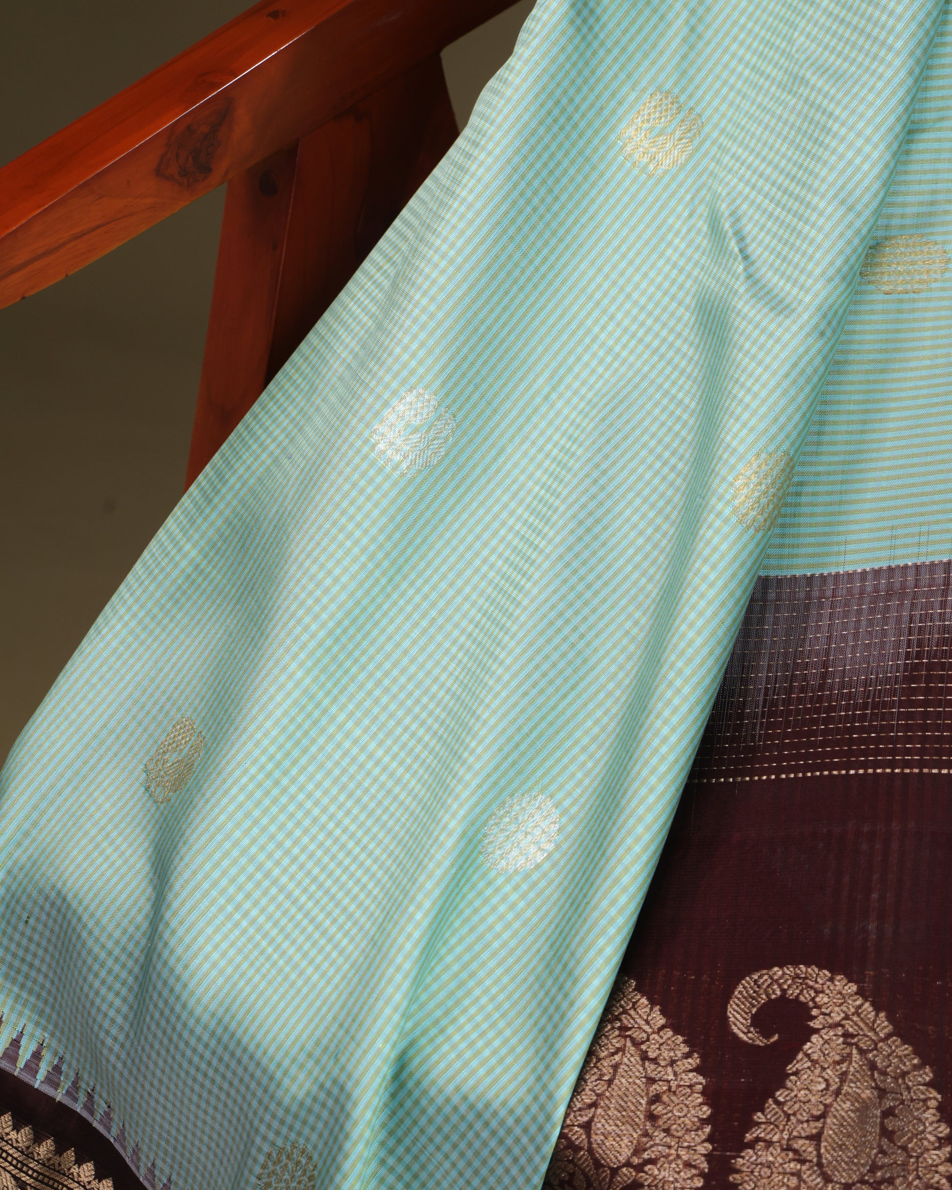 Coffee brown zari border with elephant and peacock motifs on Gadwal silk saree