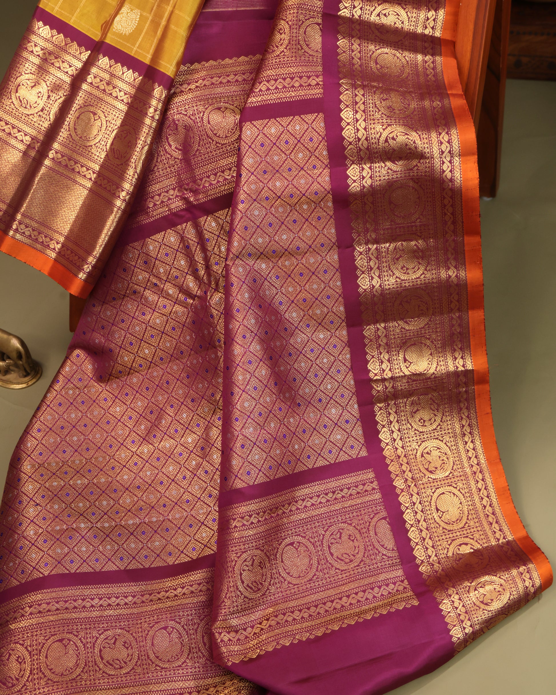Mustard Yellow Saree with Traditional Motifs and Zari Accents on the Border