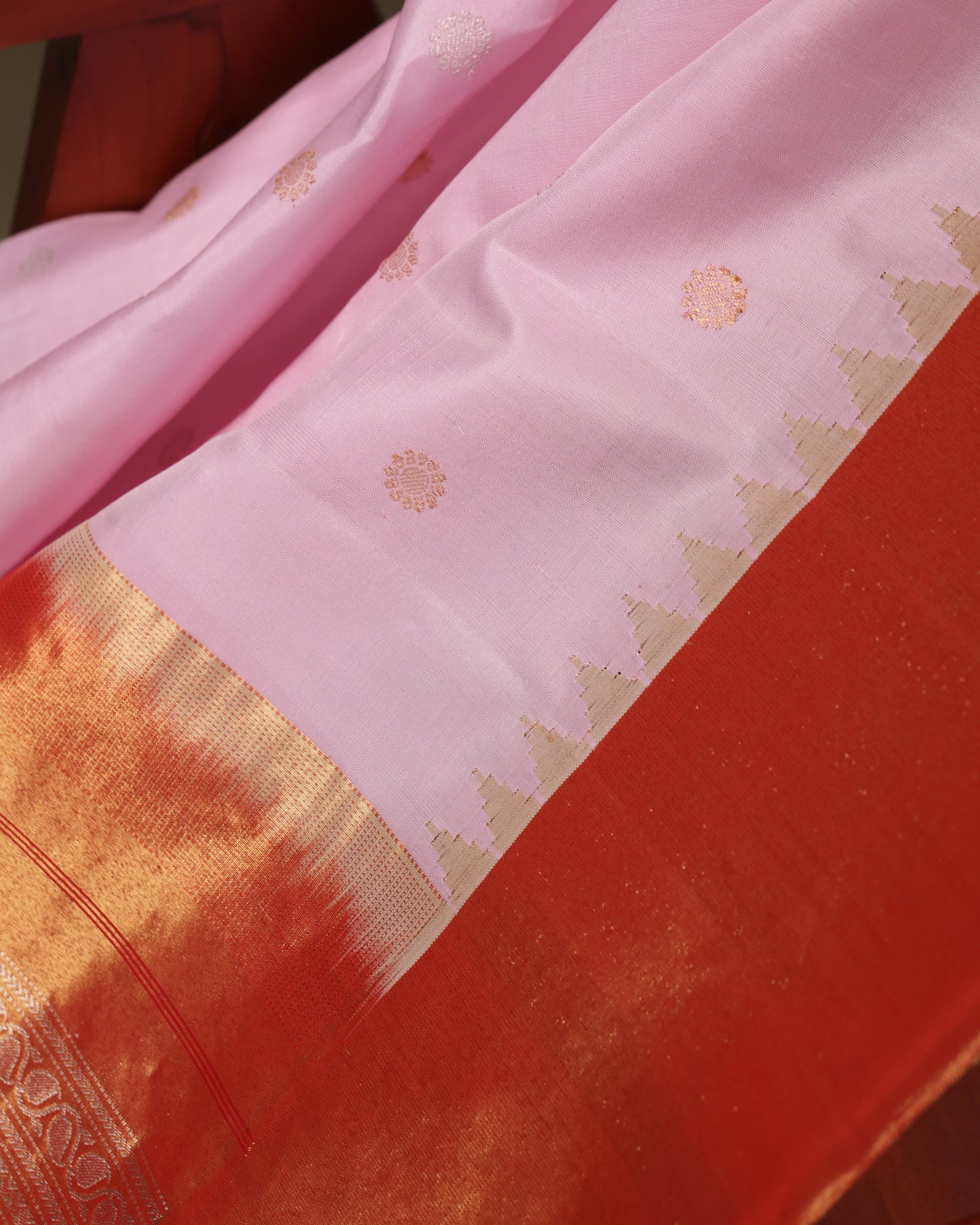 Contrast orange blouse with tissue Kanchi zari border, included with Gadwal silk saree