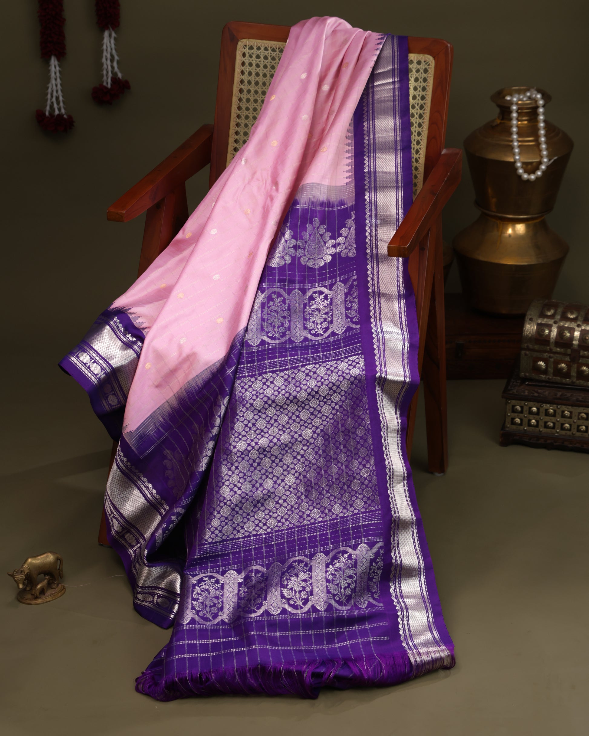 Handwoven Gadwal saree in light pink with silver zari motifs