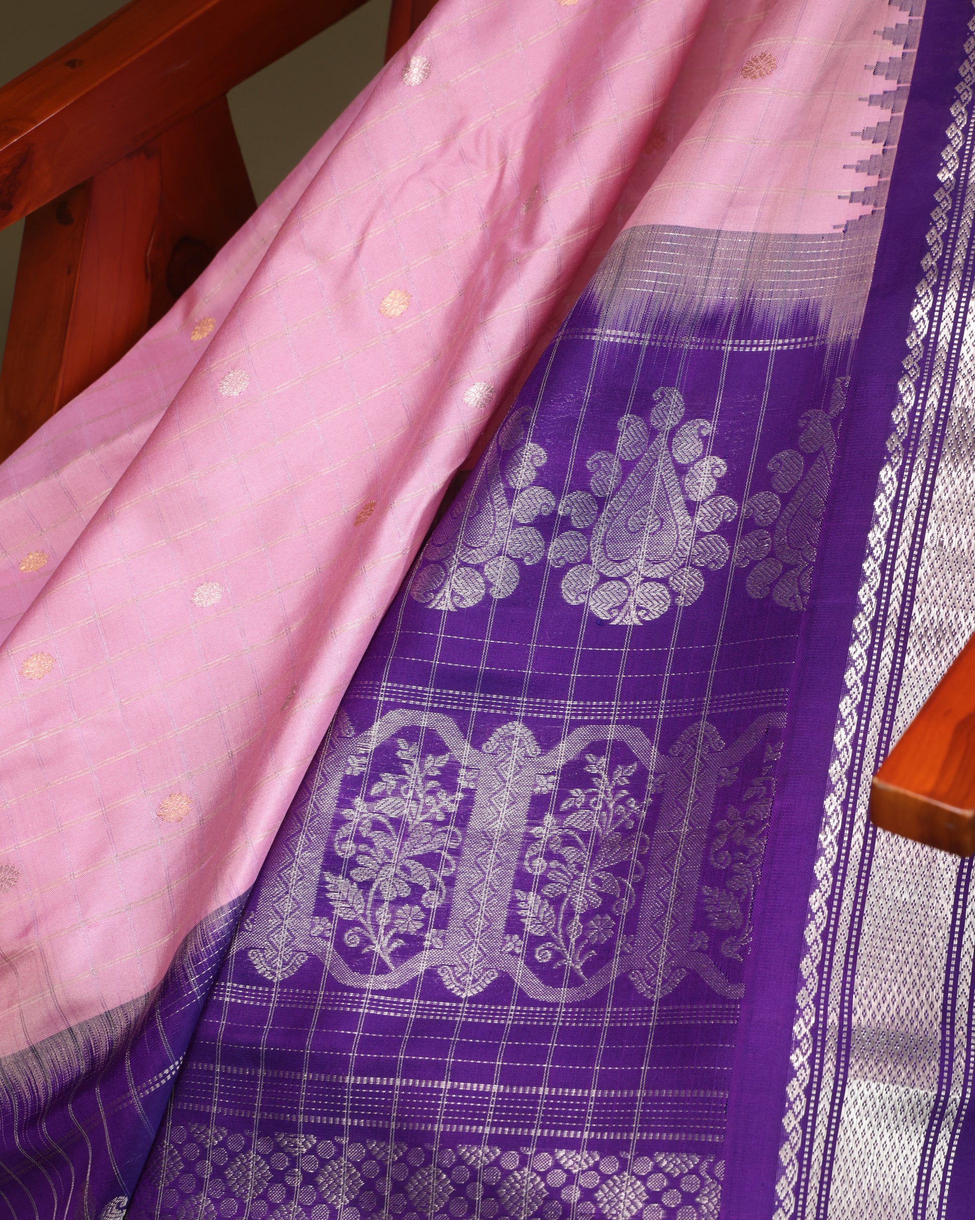 Gadwal silk saree with pink body, purple contrast, and silver zari work