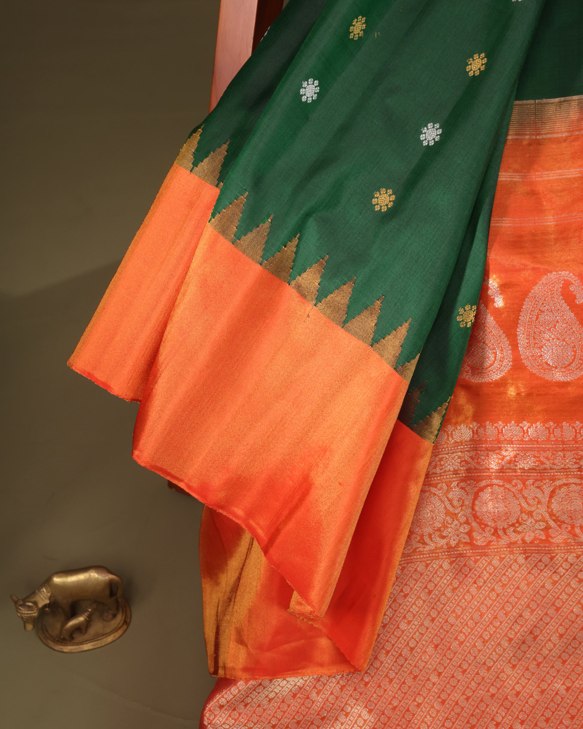 Traditional green Gadwal silk saree with rich orange tissue pallu