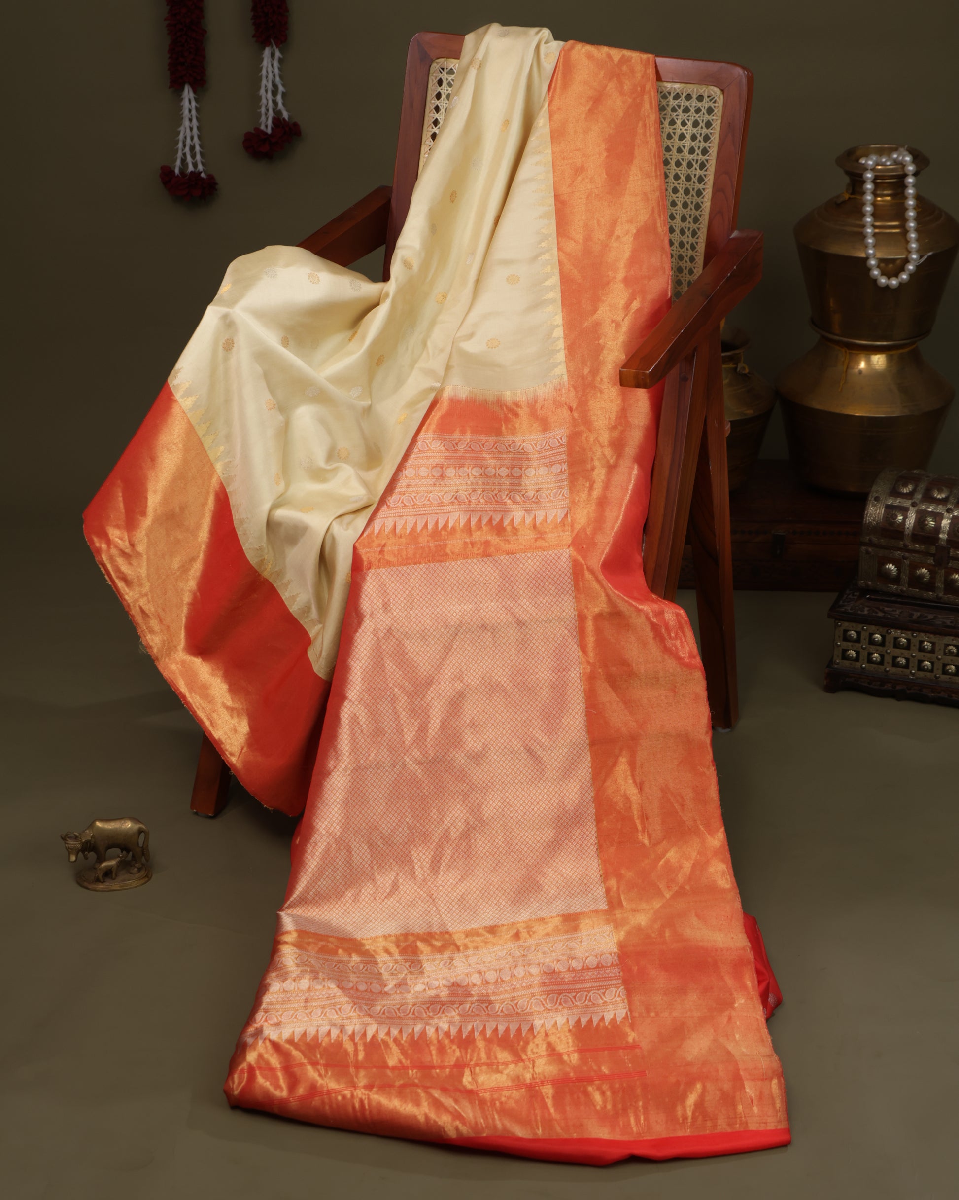Elegant cream Gadwal saree with orange tissue zari pallu