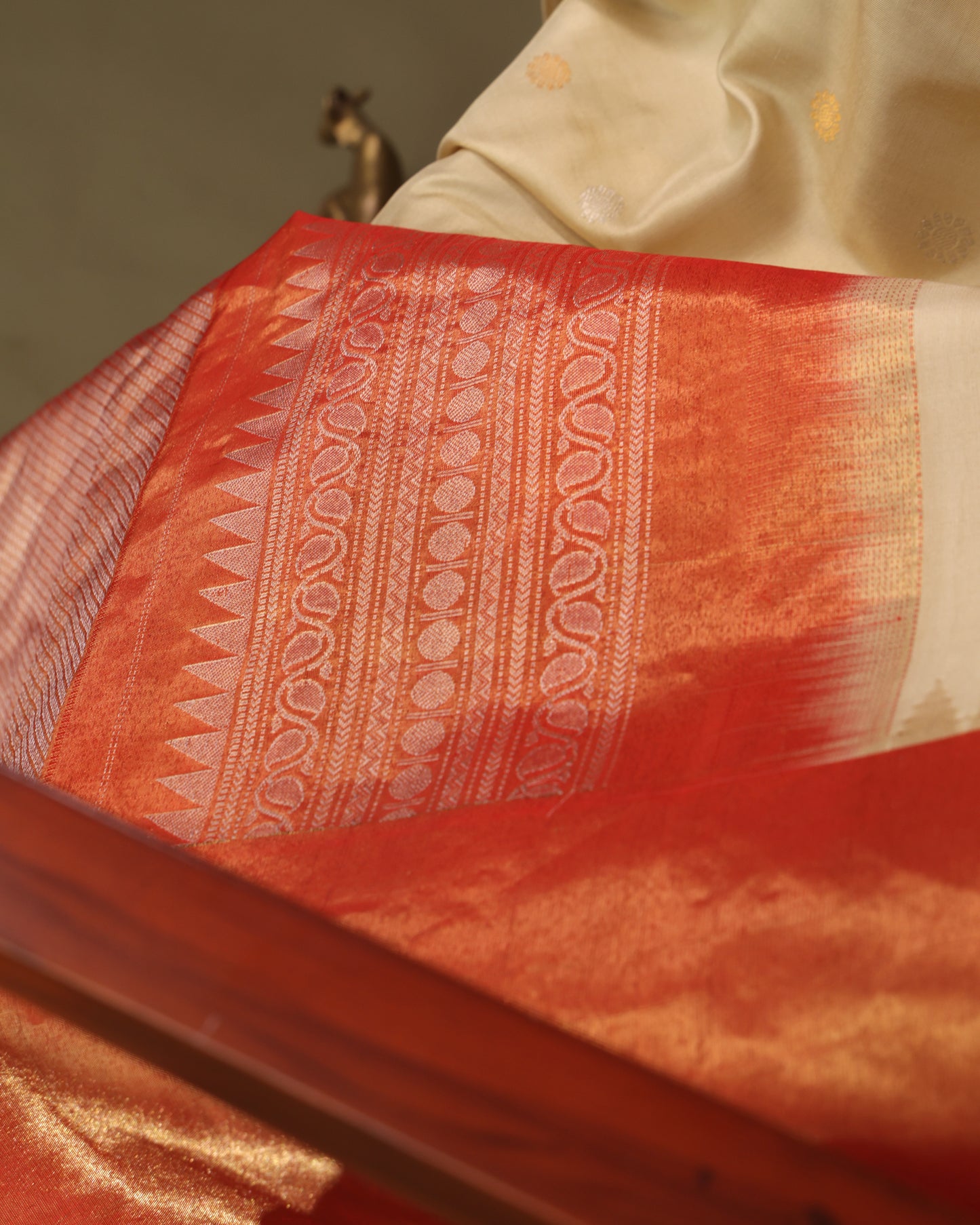 Unstitched contrast orange blouse with zari buttas and tissue border, included with Gadwal silk saree
