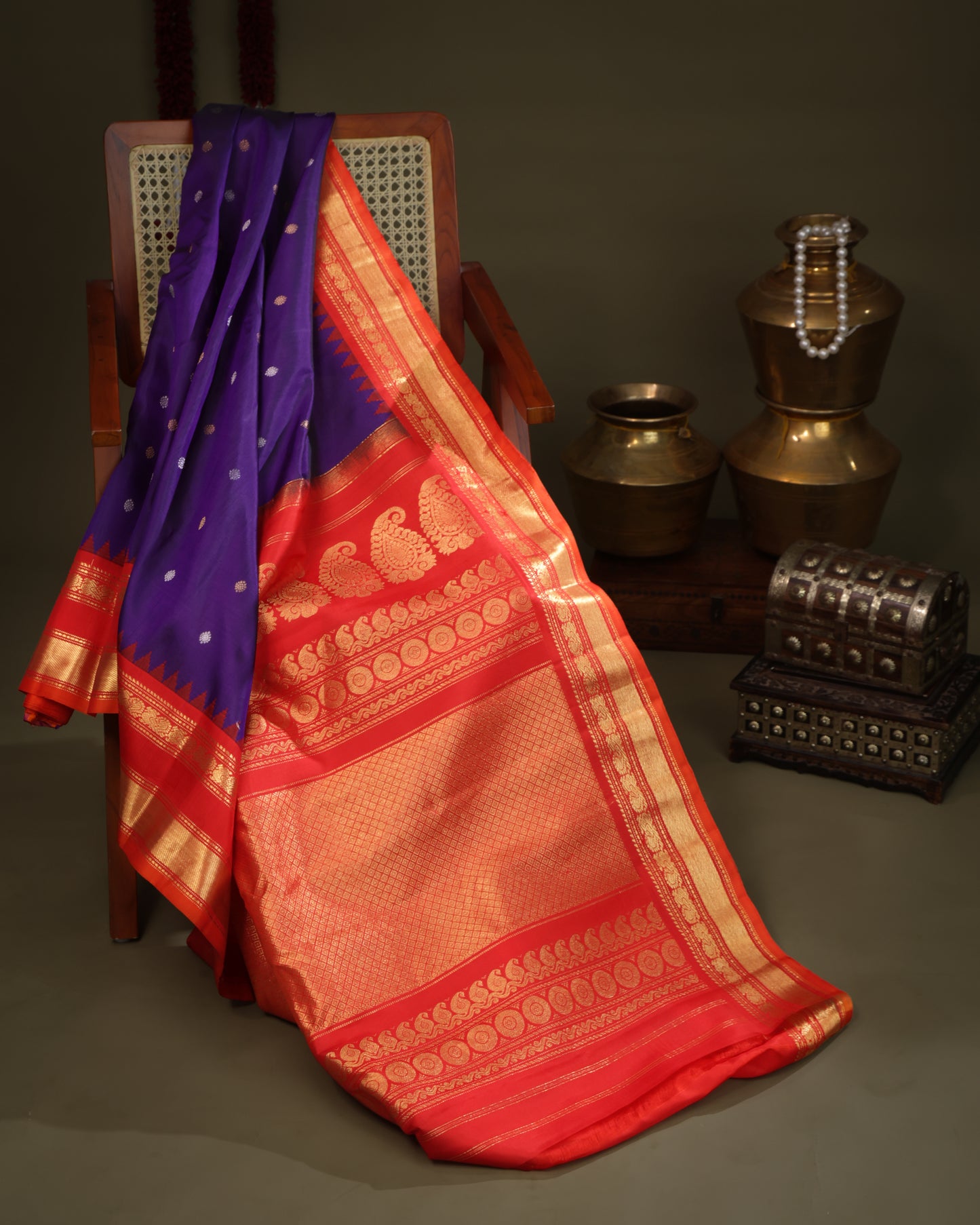 Gadwal silk saree in purple with zari butas and red contrast border