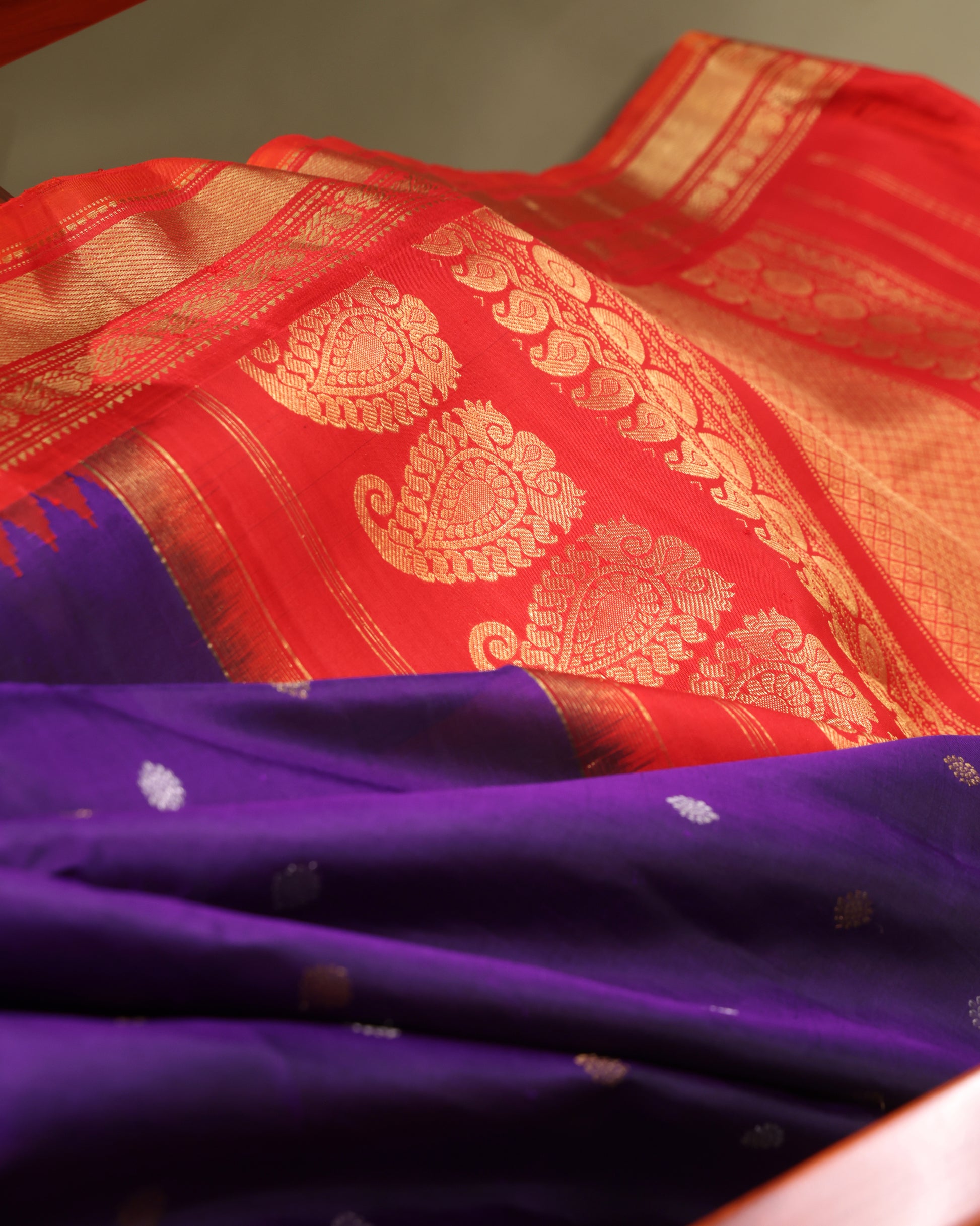 Handwoven Gadwal silk saree in purple with red temple border