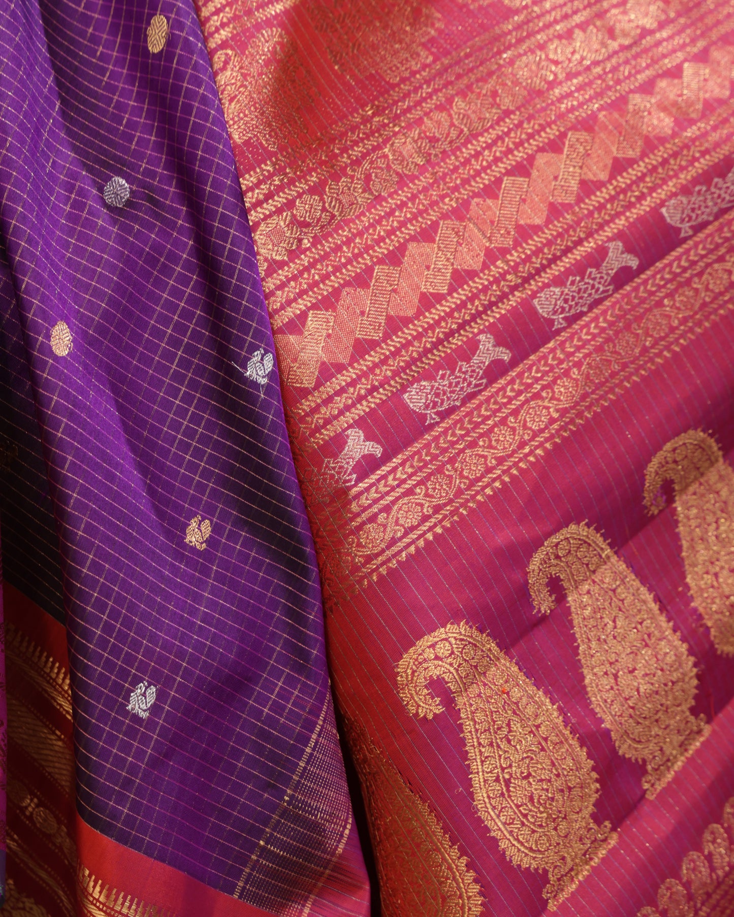Rich zari woven pallu on purple and pink Gadwal silk saree