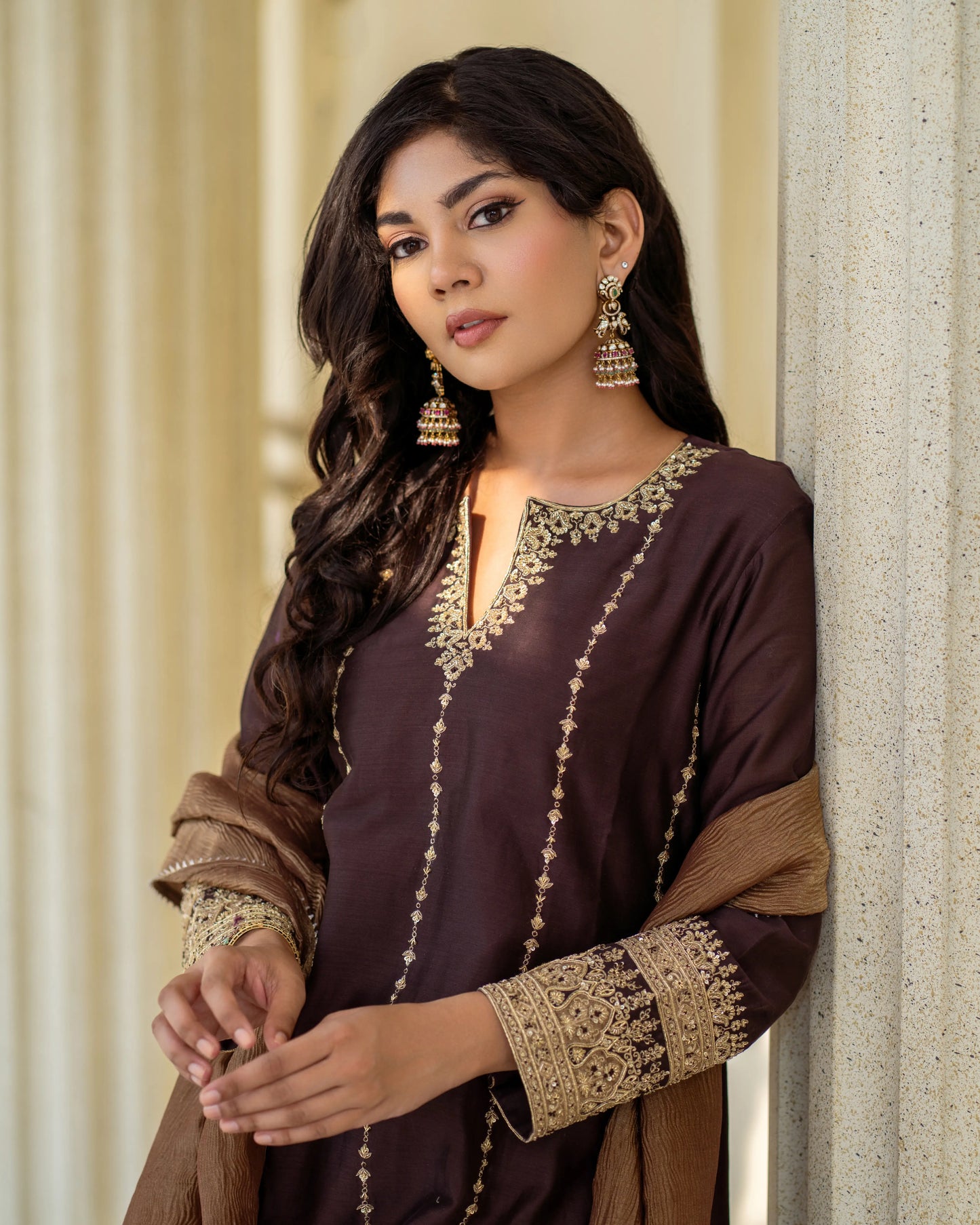 Rich fabric with intricate golden zari embroidery – traditional brown kurta suit for Indian festivities