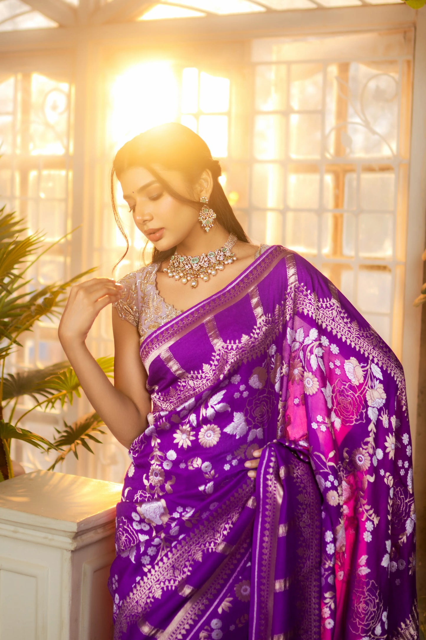 Elegant purple handloom saree with woven zari motifs and contrast borders
