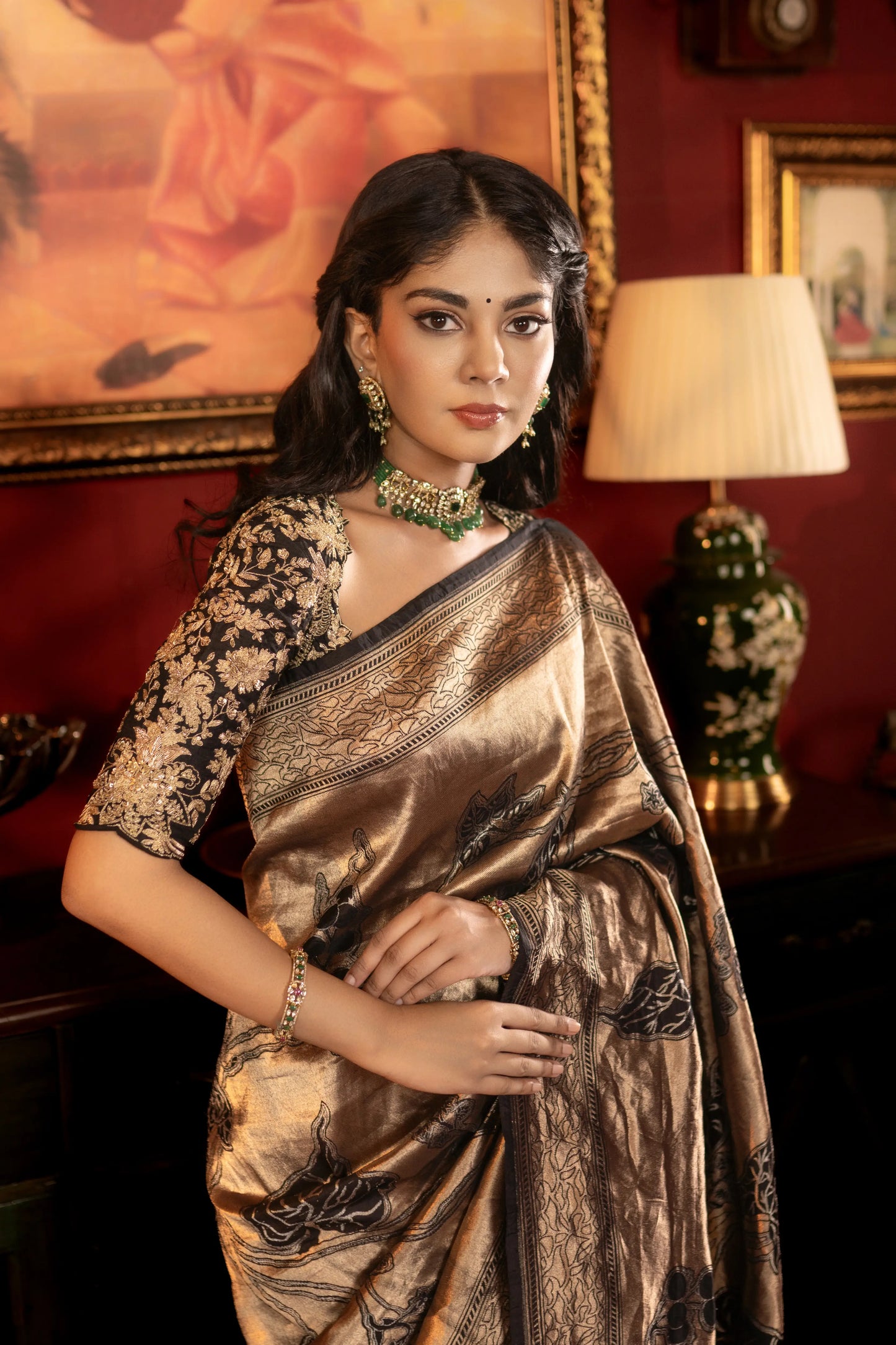 Tissue silk saree in antique gold with brocade border and floral motifs