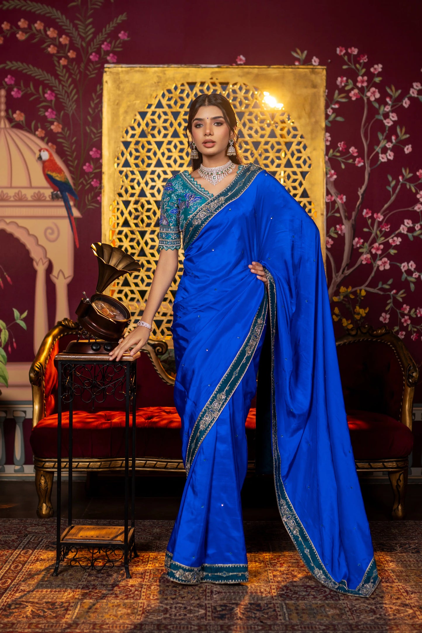Designer blue silk saree with elegant drape and embroidered accents
