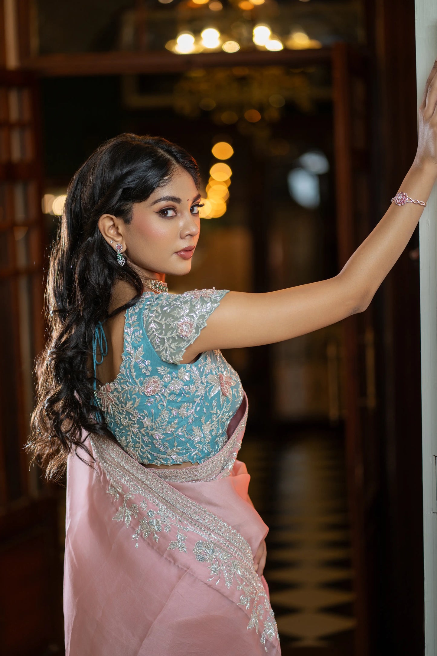 Elegant pink organza saree with gradient tone and delicate detailing