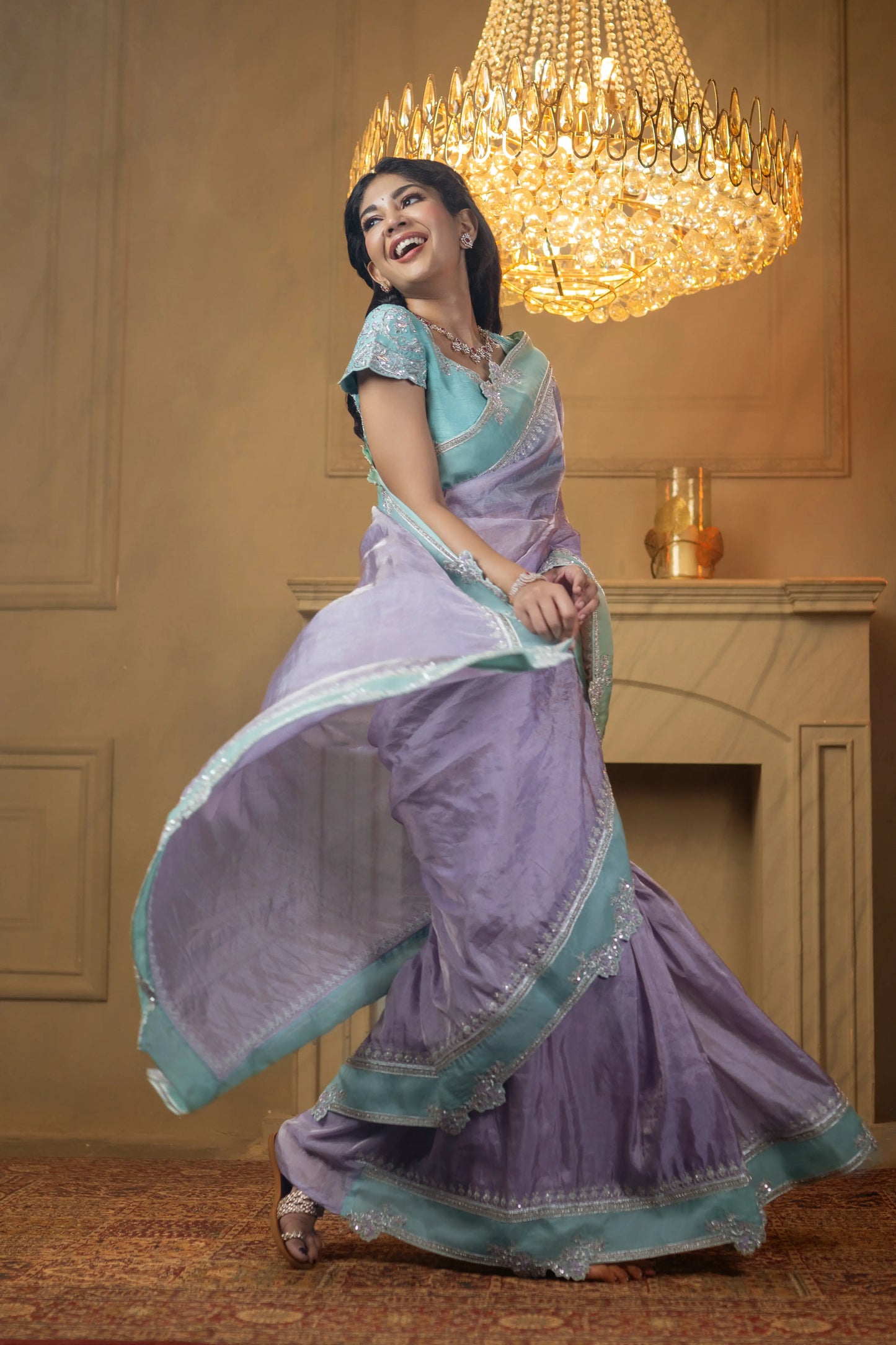 Lightweight tissue saree in soft pastel tones with sequin details