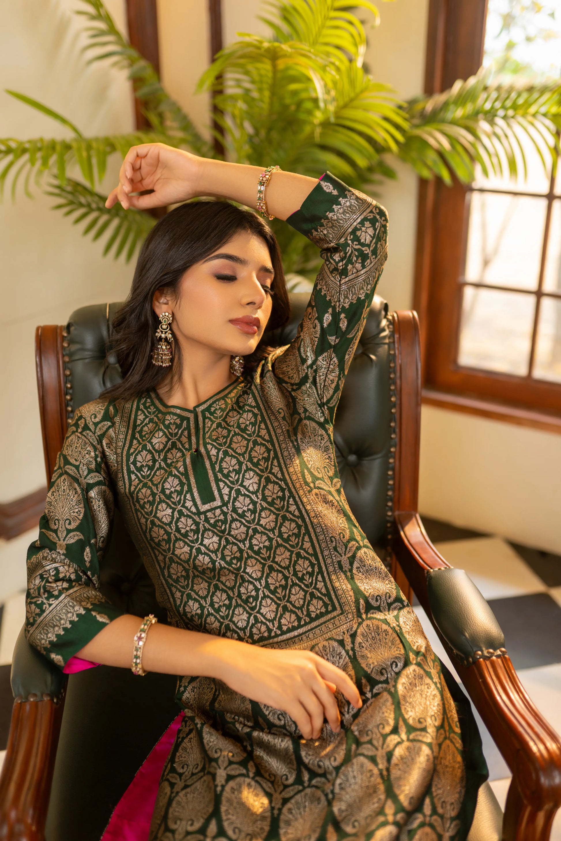 Dark green festive kurta set with zari detailing and brocade pants – timeless Indian ensemble