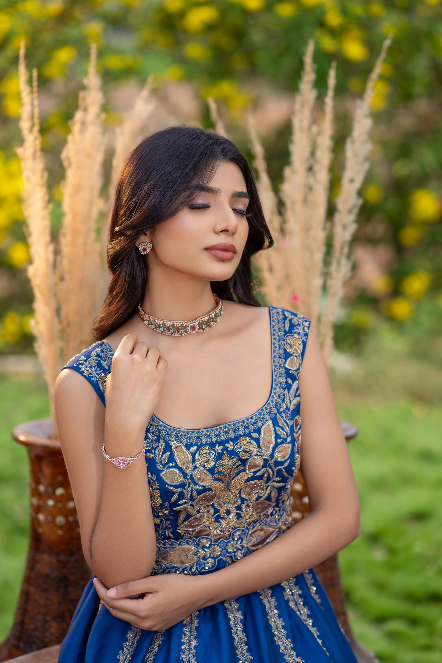Designer Indian gown in royal blue with antique gold hem detailing
