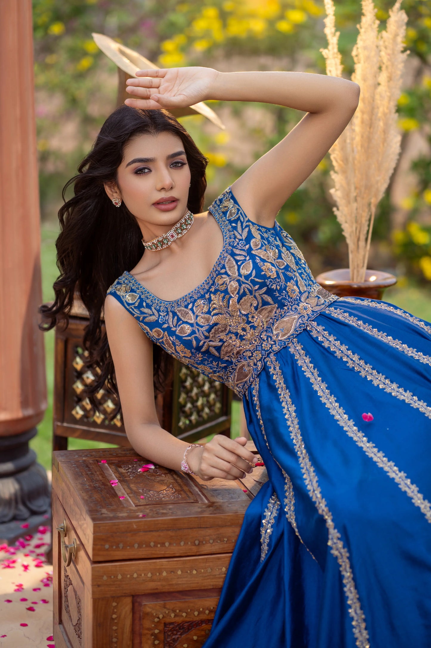 Floor-length festive gown in royal blue with traditional gold threadwork