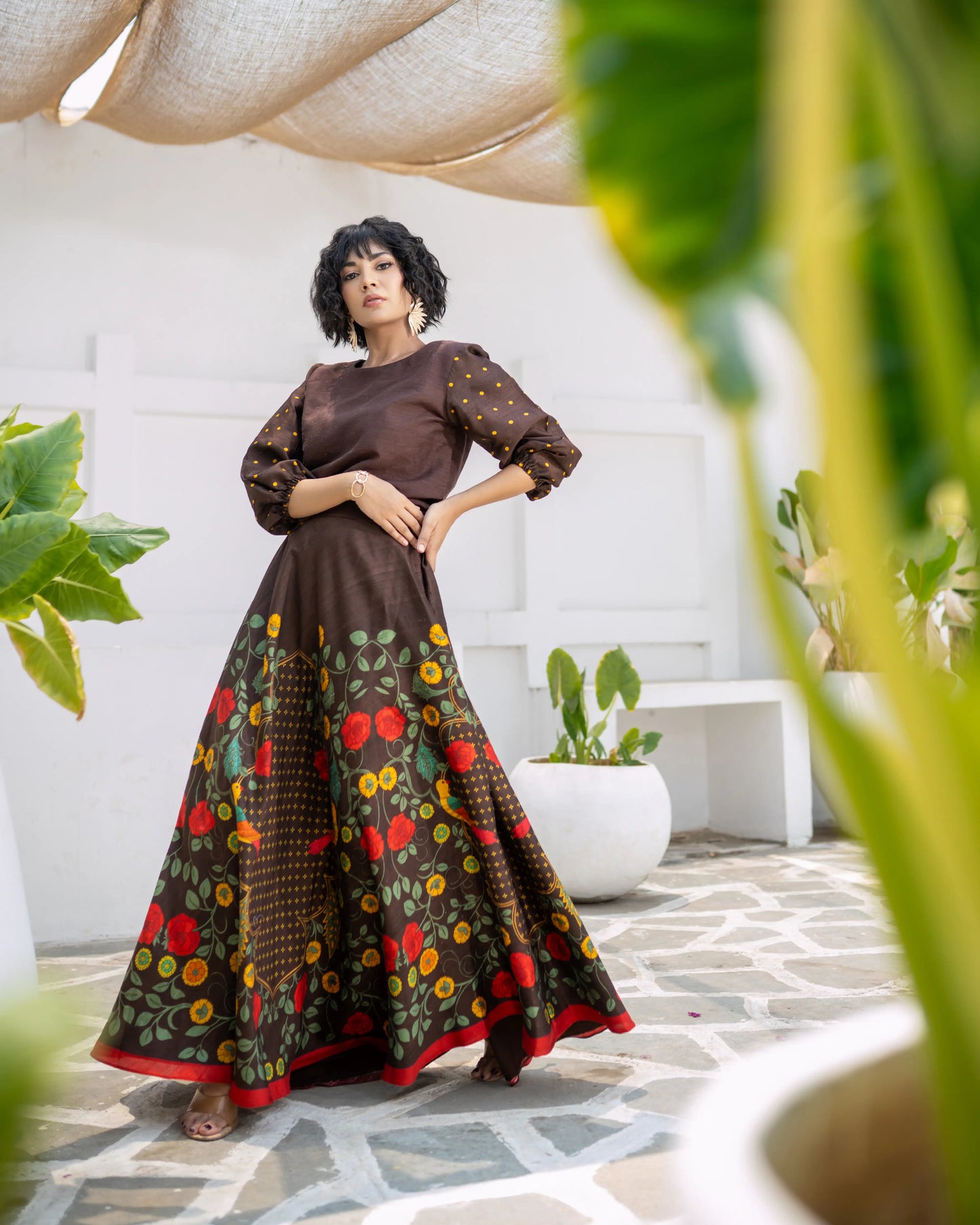 Two-piece ethnic outfit in brown with dotted sleeve top and floral skirt