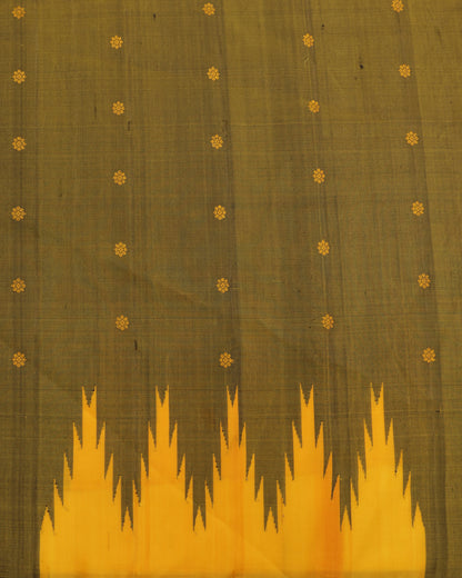 Olive green blouse with zari border paired with mustard yellow Gadwal silk saree