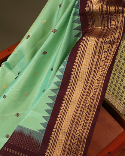 Festive aqua green Gadwal silk saree with coffee brown border