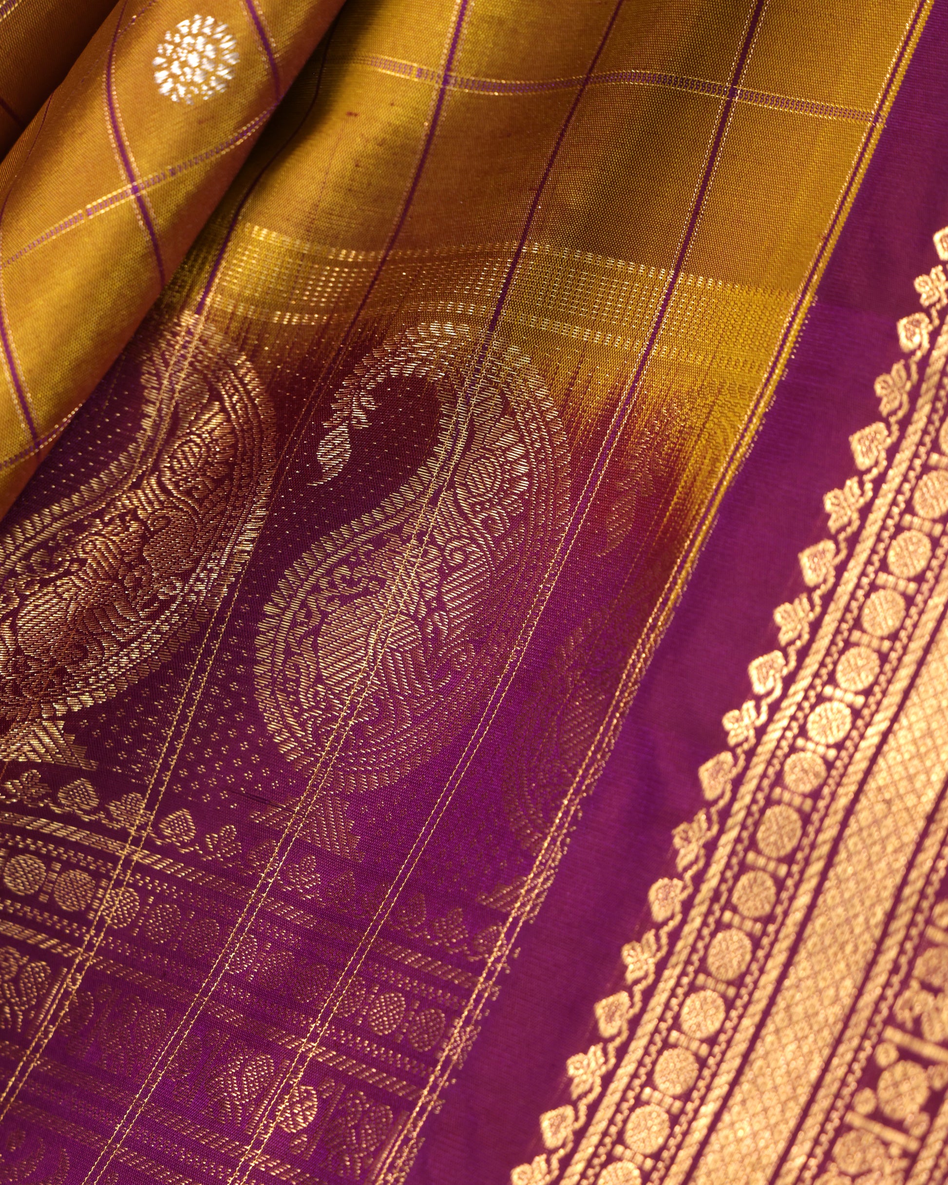 Contrast purple unstitched blouse with gold zari buttas and Kanchi border, included with Gadwal silk saree