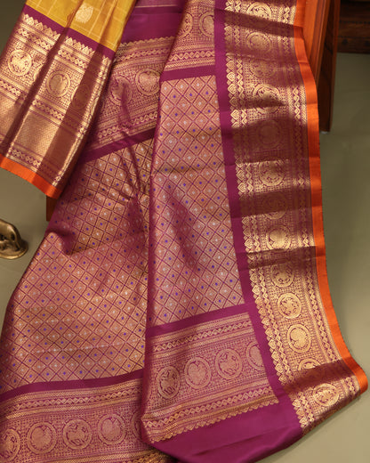 Mustard Yellow Saree with Traditional Motifs and Zari Accents on the Border
