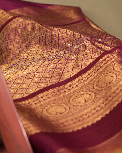 Purple unstitched blouse fabric with intricate gold zari border in traditional Gadwal Kanchi style