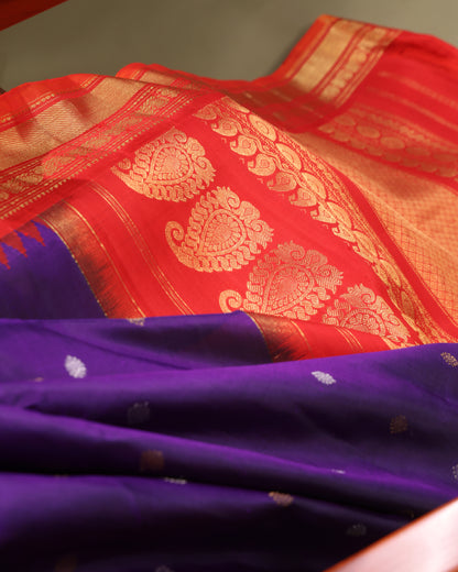 Handwoven Gadwal silk saree in purple with red temple border