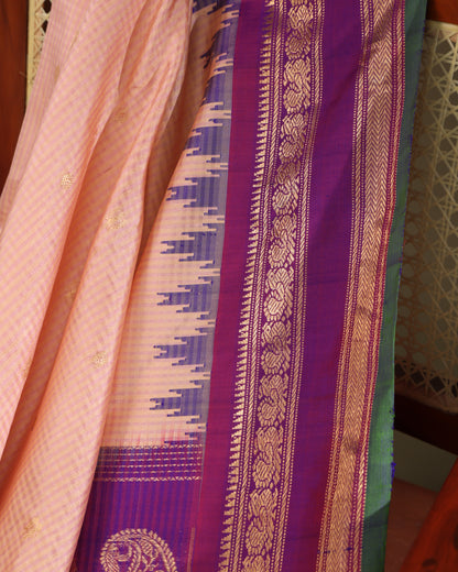 Peach Gadwal silk saree with purple blouse