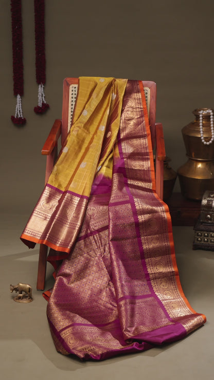 Mustard Yellow Gadwal Silk Saree with Purple Kanchi Border and Traditional Motifs